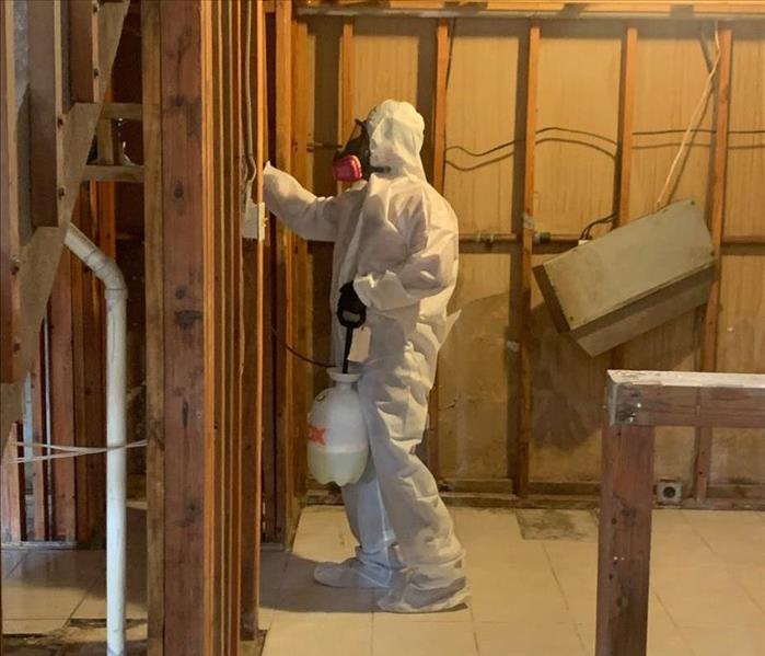 SERVPRO employee in PPE working 